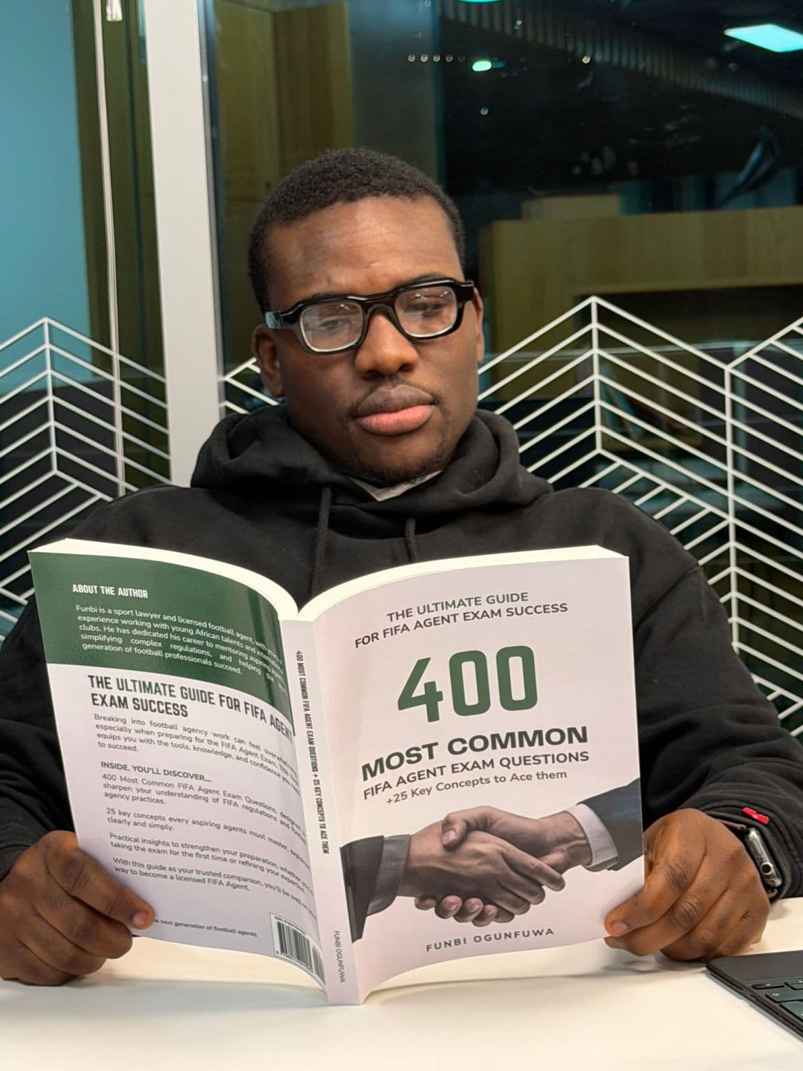 Funbi Ogunfuwa reading 400 Most Common FIFA Agent Exam Questions